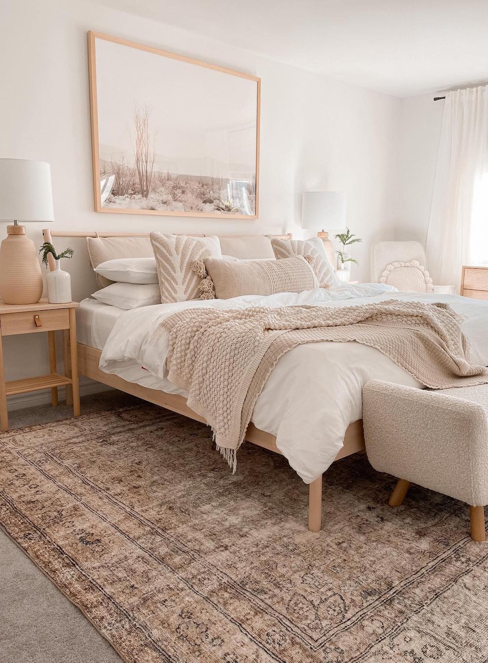 a beige and ivory boho bedroom with classic bohemian textures and decor