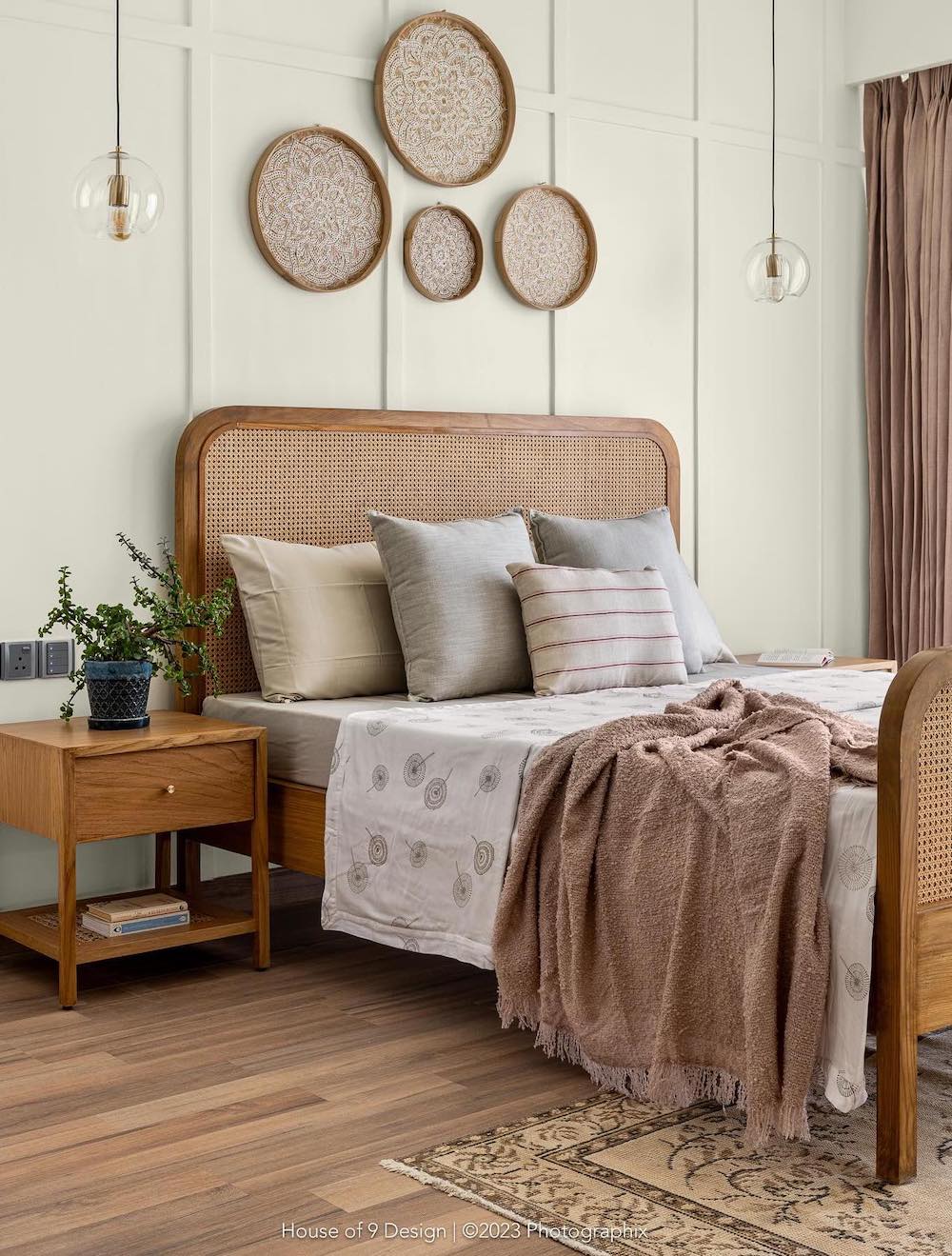 a bohemian bedroom with cocoa colored linens and touches of grey and green