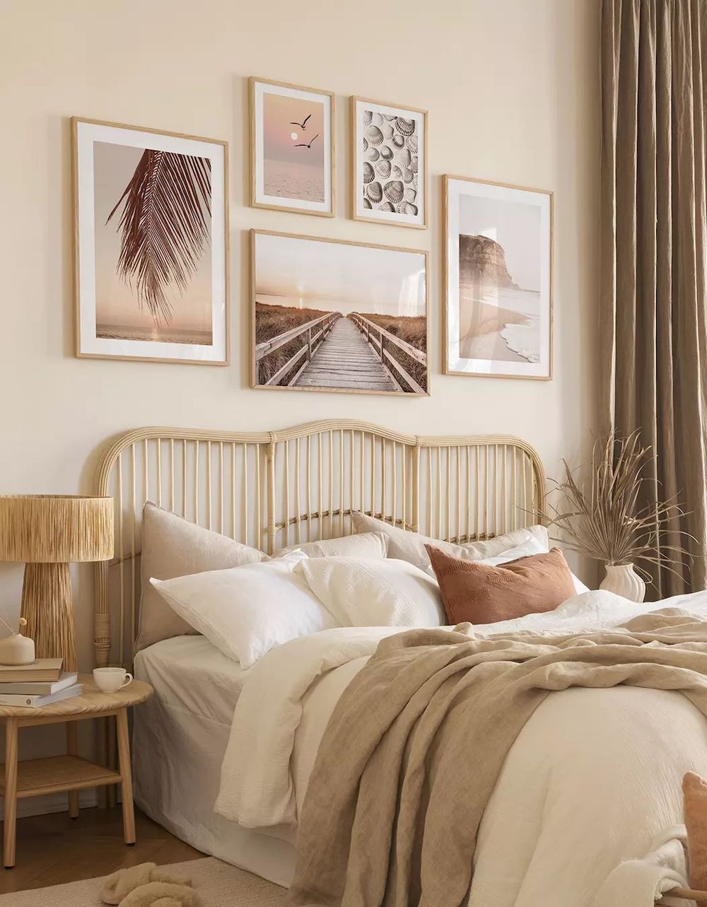 a coastal bohemian bedroom featuring neutral tones like brown, ivory, and beige with coastal wall art, and natural elements