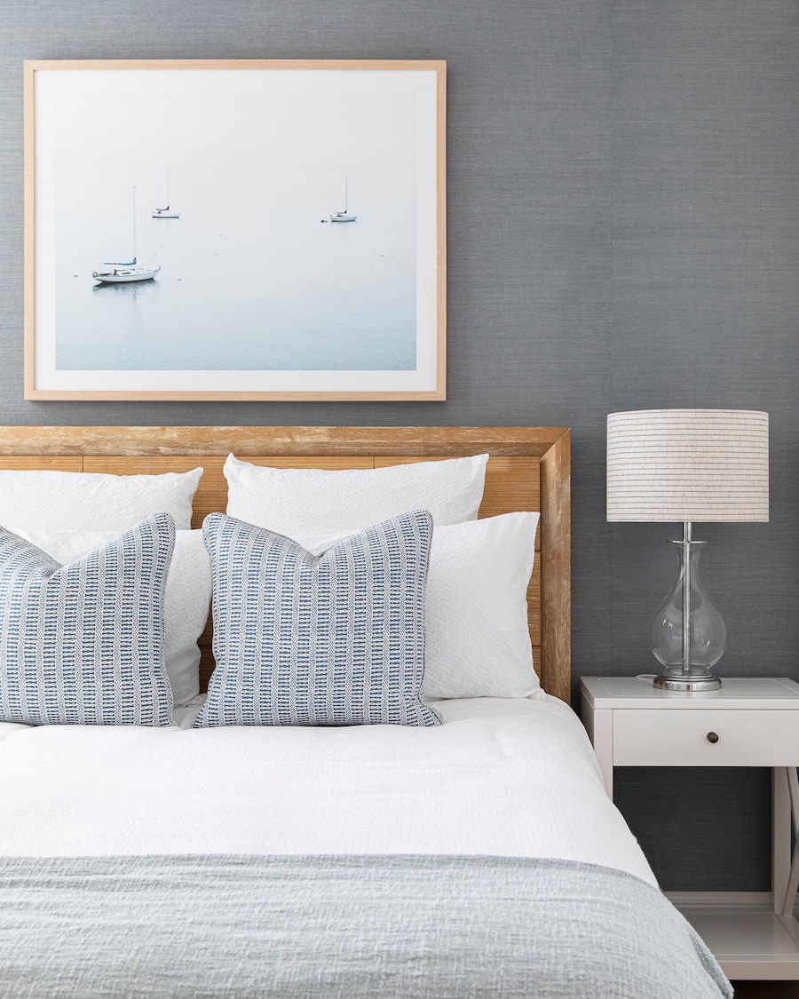 a minimalist coastal bedroom in ivory and slate grey