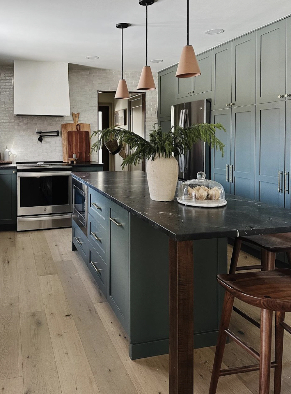 a green kitchen with pieces from Ikea