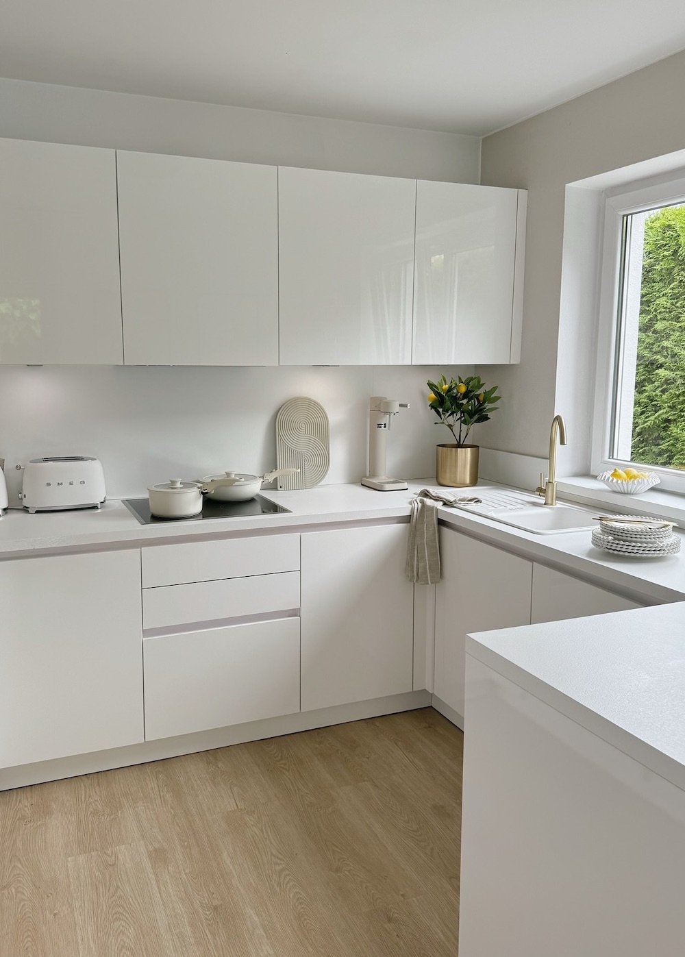 a clean, white, and modern kitchen with pieces from Ikea