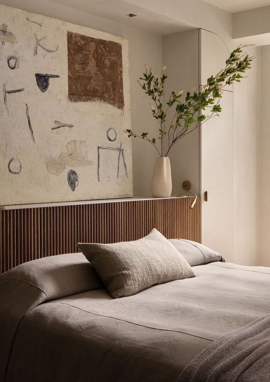 an organic modern bedroom with a unique moody aesthetic