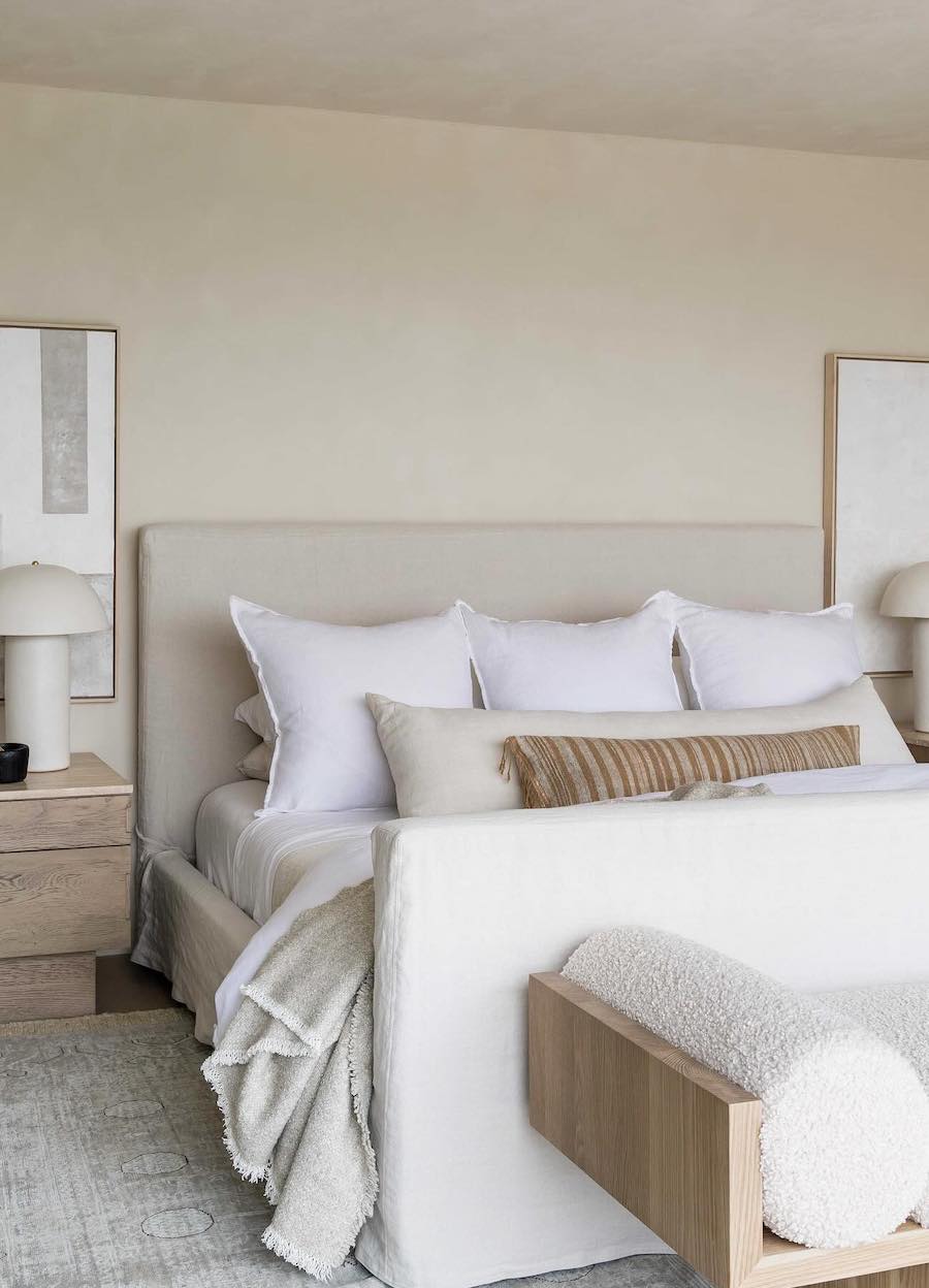 a light and airy bedroom featuring cream, ivory, and ecru tones with a minimalist design style