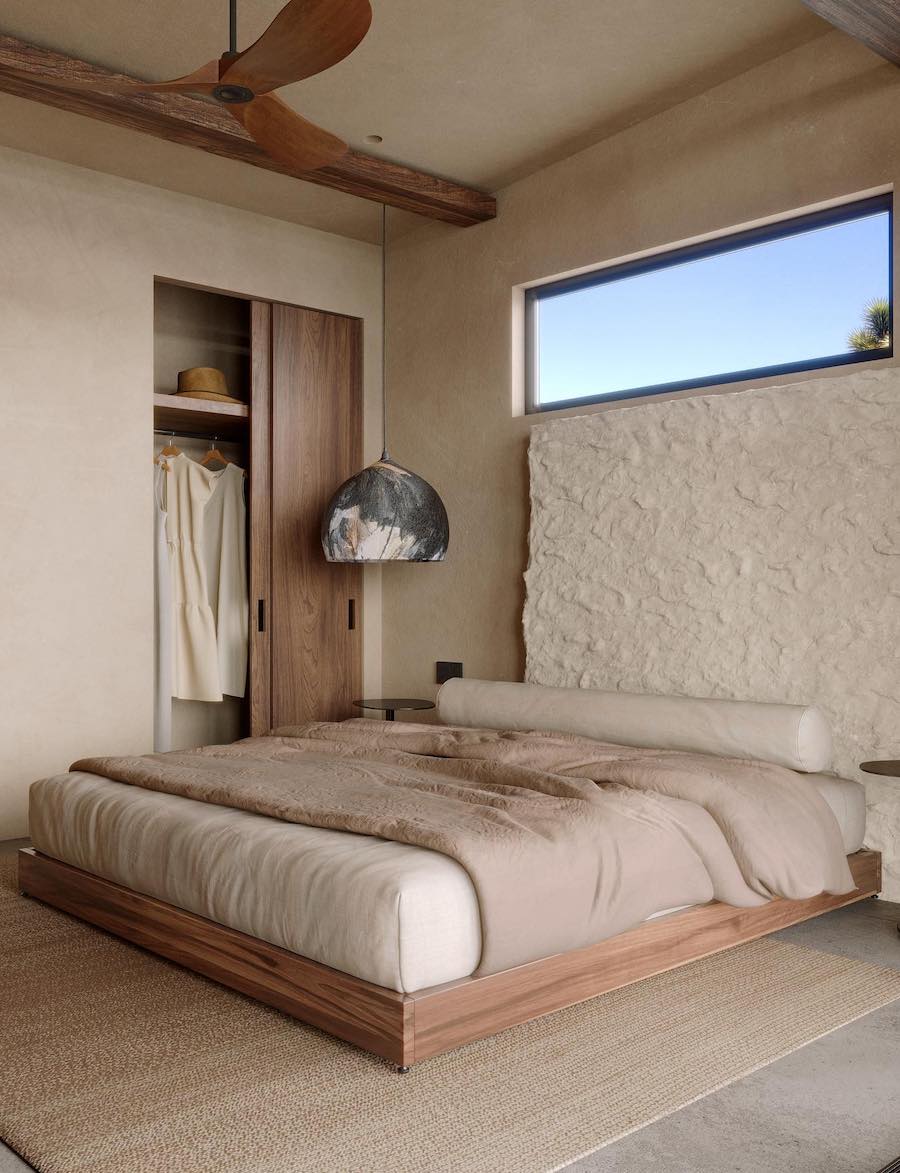 an organic modern bedroom with a large ivory textured headboard, cream and ecru tones, and earthy minimalist decor