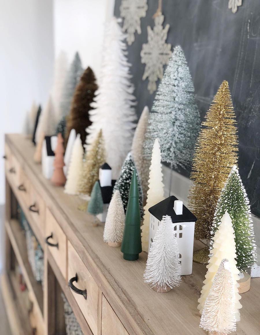 a variety of small christmas trees in different colors and textures