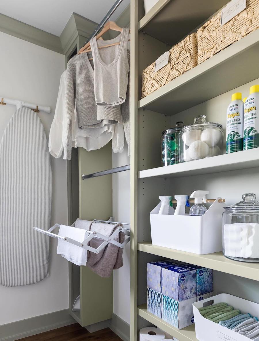 laundry room organization featuring pull out drying racks and open shelving