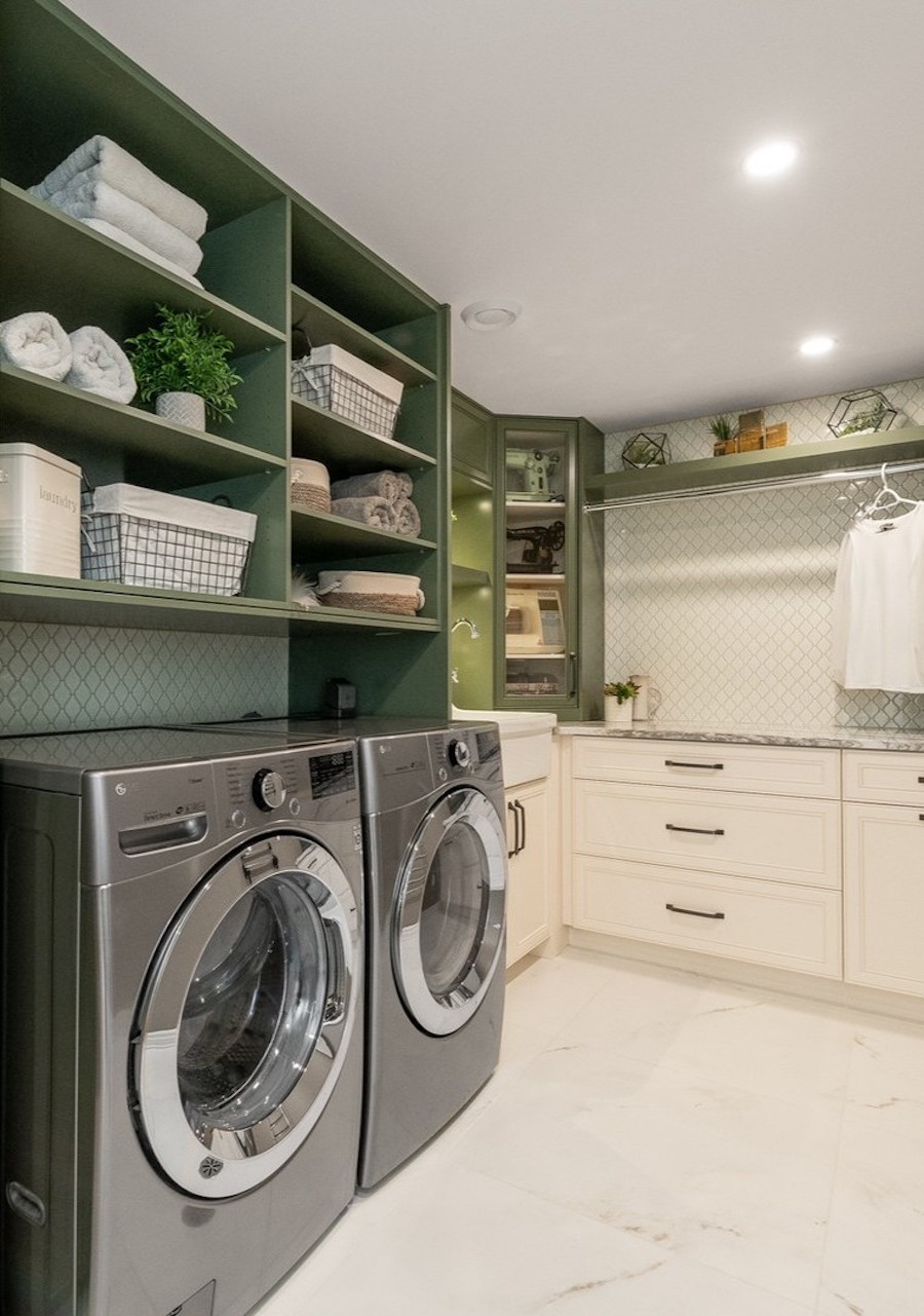 laundry room organization featuring over the machine shelves, built-in drawers, and hanging rods