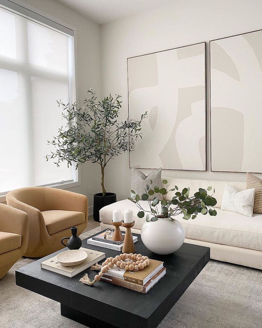 a living room with black, white, and warm neutrals and organic modern decor