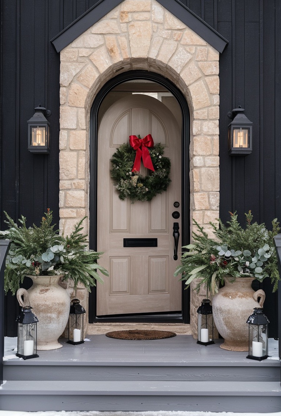 a front porch with outdoor Christmas decorations such as winter foliage, lanterns, and a winter wreath