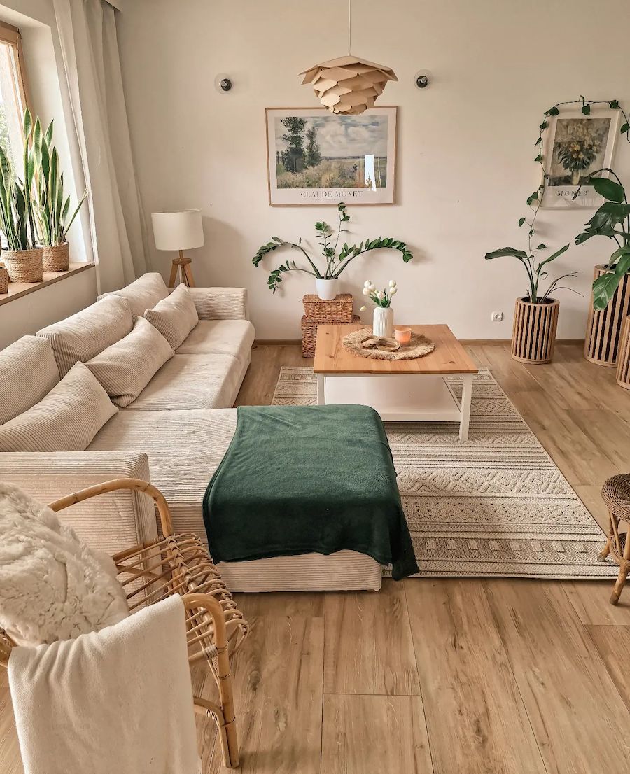 a bohemian living room featuring beige and earthy green tones