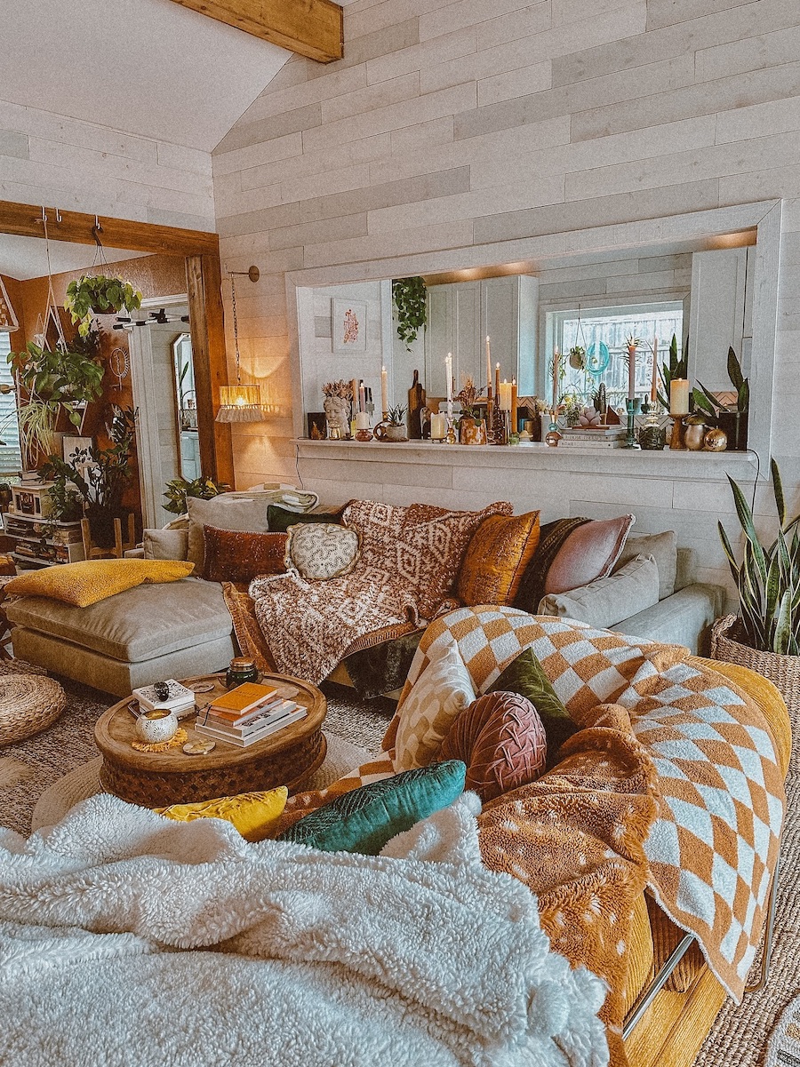 a bohemian living room featuring colorful earthy shades and retro flair