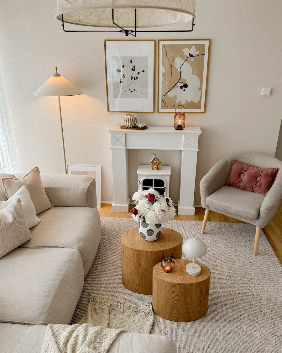 a bohemian living room featuring an earthy warm palette and floral decor