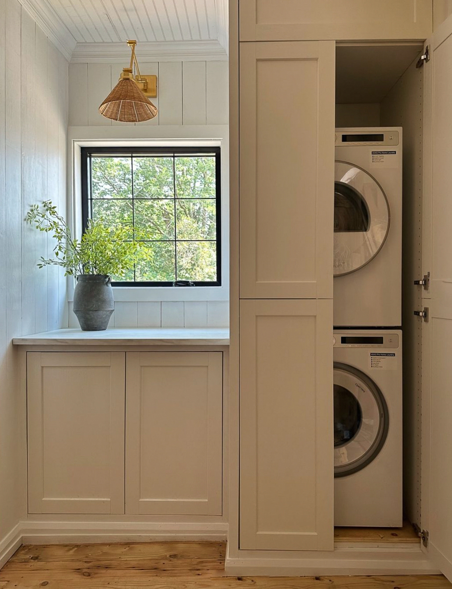 a cottage style laundry room with a minimal design