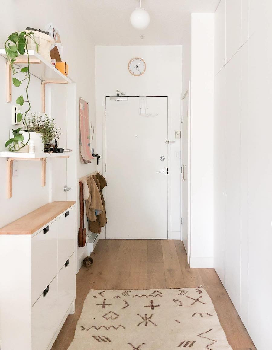 an entryway with clever storage and boho decor