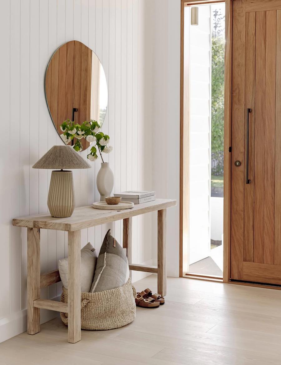 an entryway with simple cool-toned decor