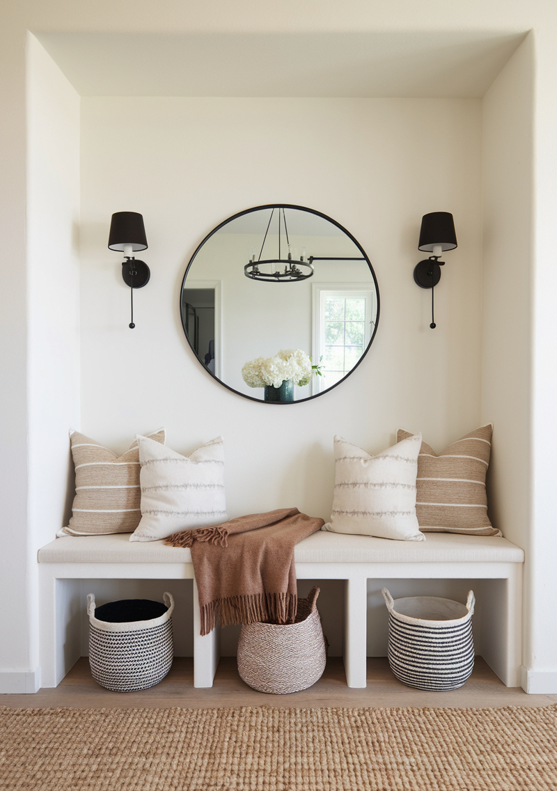 an entryway with white and sandy tones and minimal decor