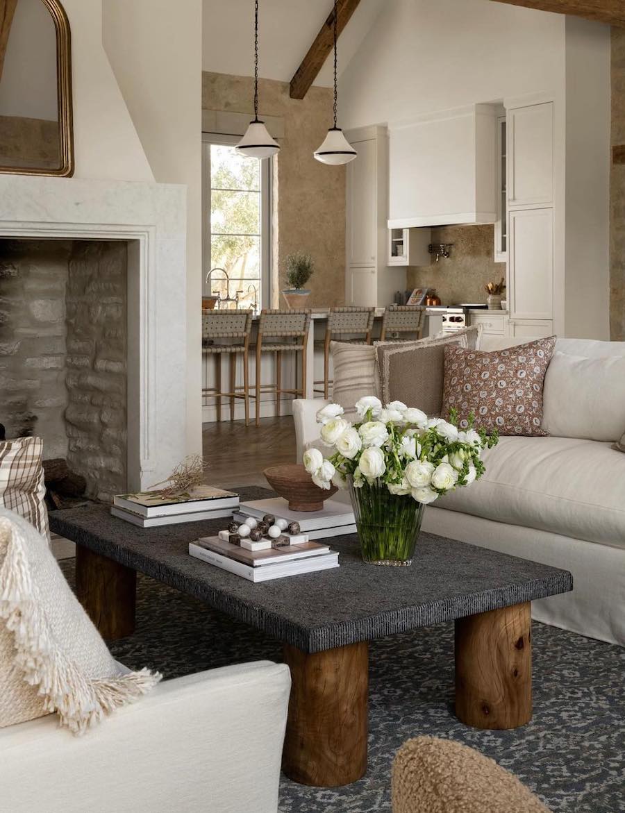 a living room featuring black and white and beige furnishings