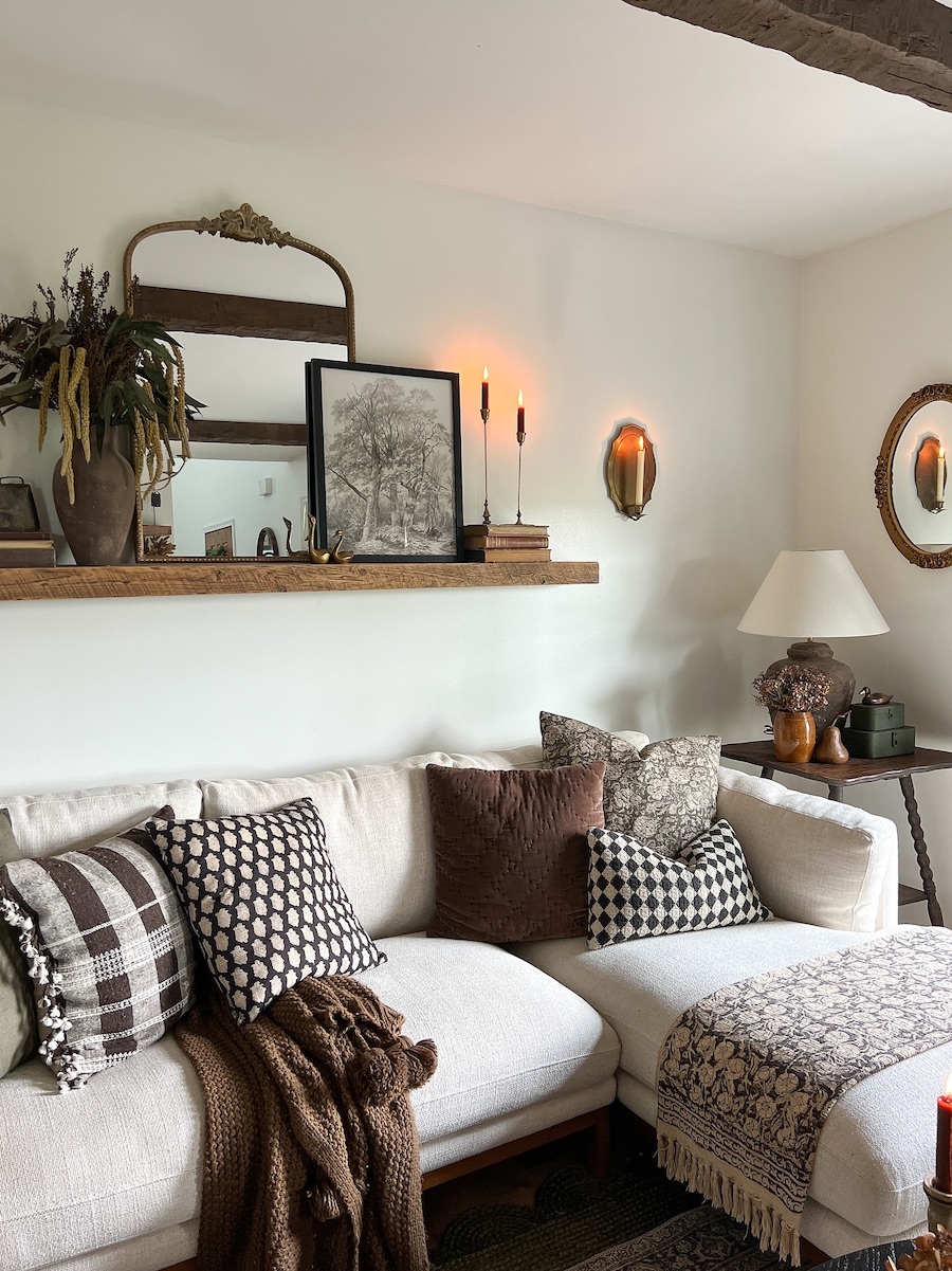 a living room featuring brown and white furnishings