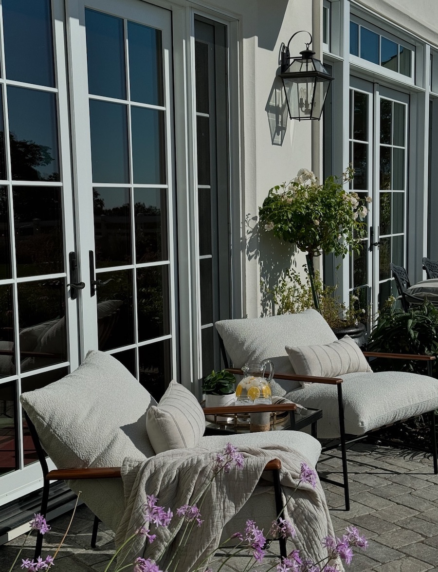 a backyard patio with soft lounge chairs