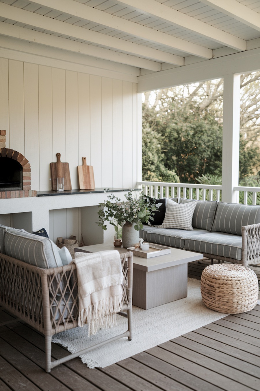 a patio with beige and grey furniture and decor